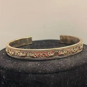 Signed NRO Avon Vintage-1970s 2.75” gold tone raised elephant bangle bracelet